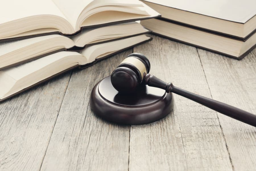 Court hammer and law books
